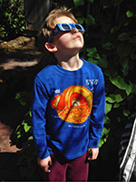Boy wearing eclipse shades